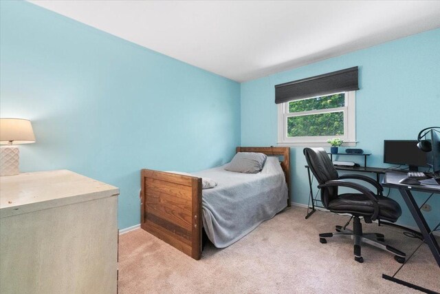 391 Northgate Rd, Lindenhurst, IL 60046 - bedroom featuring light carpet, an office area, and baseboards