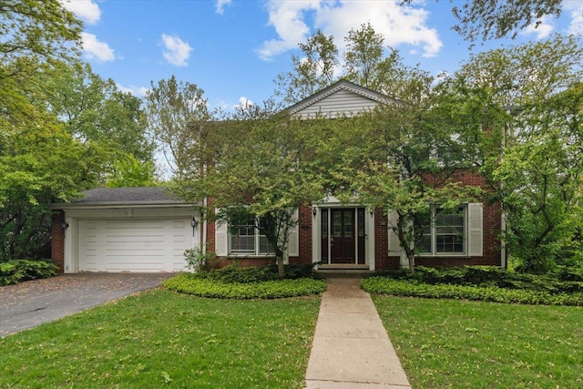 3227 River Falls Dr, Northbrook, IL 60062 - view of front of home featuring brick siding, asphalt driveway, a garage, and a front yard
