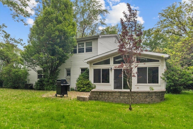3227 River Falls Dr, Northbrook, IL 60062 - rear view of property featuring a sunroom and a yard