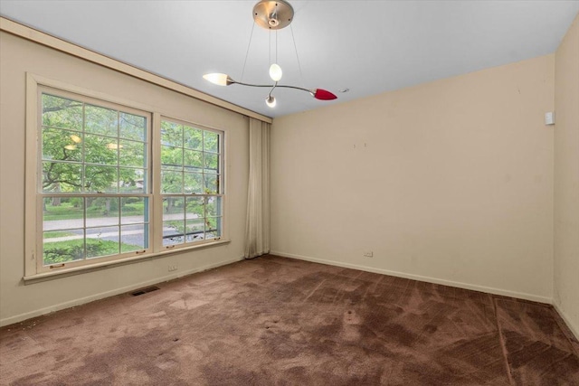 3227 River Falls Dr, Northbrook, IL 60062 - unfurnished room featuring carpet, a chandelier, healthy amount of natural light, and baseboards