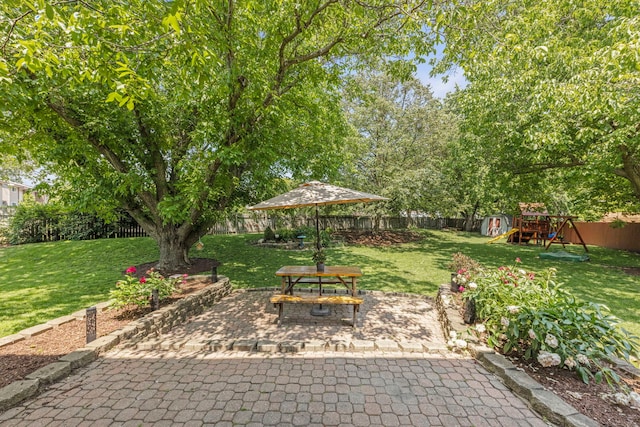 389 Pearson Cir, Naperville, IL 60563 - fenced backyard with a playground and a patio