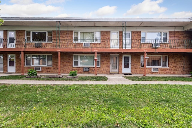 241 Northway Park Rd Unit 10, Machesney Park, IL 61115 - view of front facade featuring a front yard and brick siding
