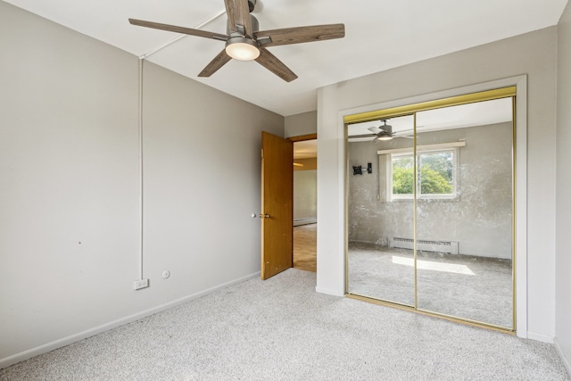 241 Northway Park Rd Unit 10, Machesney Park, IL 61115 - unfurnished bedroom featuring a baseboard heating unit, carpet, ceiling fan, and baseboards