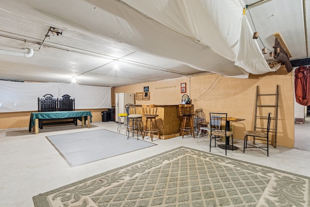 241 Northway Park Rd Unit 10, Machesney Park, IL 61115 - basement with freestanding refrigerator and a dry bar