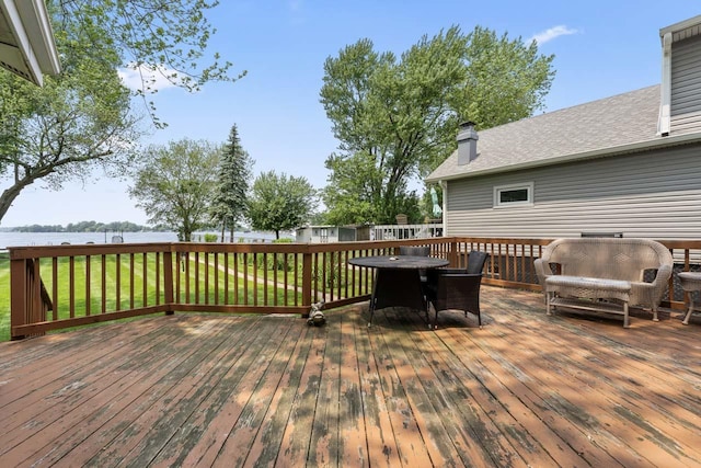 35632 N Sheridan Dr, Fox Lake, IL 60020 - deck with a water view, outdoor dining area, and a yard