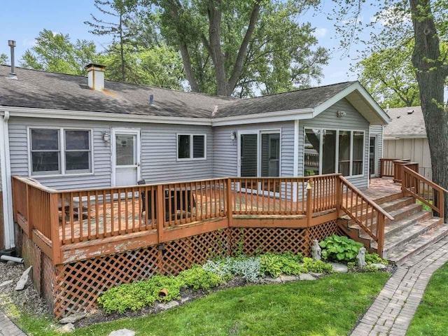 35632 N Sheridan Dr, Fox Lake, IL 60020 - back of house with a deck, a shingled roof, and a chimney
