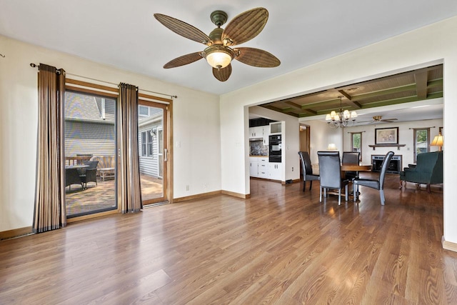 35632 N Sheridan Dr, Fox Lake, IL 60020 - dining room featuring a ceiling fan, wood finished floors, a chandelier, and beam ceiling