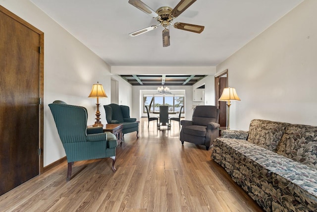 35632 N Sheridan Dr, Fox Lake, IL 60020 - living room featuring coffered ceiling, wood finished floors, a ceiling fan, a chandelier, and beam ceiling
