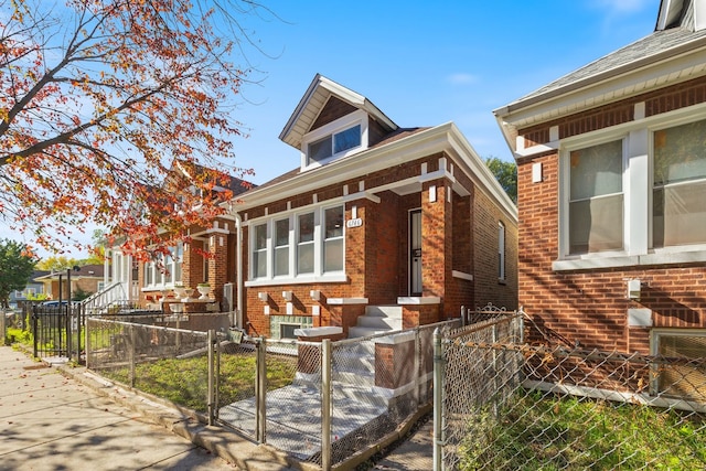 6746 S Honore St, Chicago, IL 60636 - view of front facade featuring brick siding, a gate, and a fenced front yard