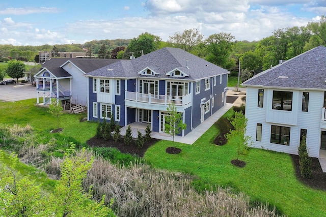 571 Mill St Unit 2, Fontana, WI 53125 - back of property featuring a lawn and roof with shingles