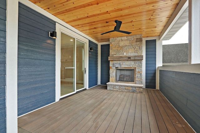 571 Mill St Unit 2, Fontana, WI 53125 - wooden terrace with an outdoor fireplace and a ceiling fan