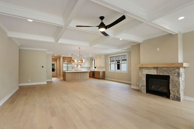 571 Mill St Unit 2, Fontana, WI 53125 - unfurnished living room featuring coffered ceiling, a fireplace, baseboards, a ceiling fan, and light wood finished floors
