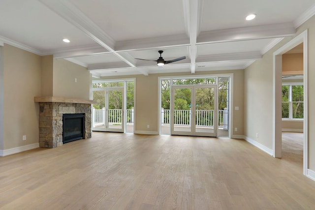 571 Mill St Unit 2, Fontana, WI 53125 - unfurnished living room featuring baseboards, light wood-style flooring, a stone fireplace, coffered ceiling, and beam ceiling