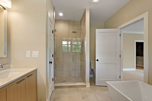 571 Mill St Unit 2, Fontana, WI 53125 - full bath featuring a stall shower, vanity, baseboards, a freestanding tub, and recessed lighting
