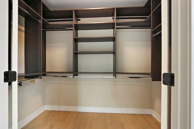 571 Mill St Unit 2, Fontana, WI 53125 - spacious closet with wood finished floors