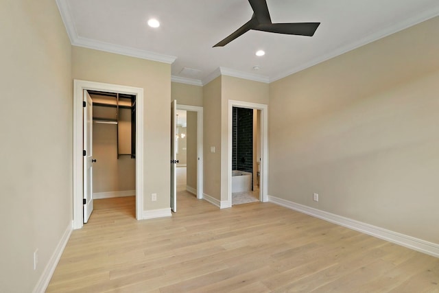 571 Mill St Unit 2, Fontana, WI 53125 - unfurnished bedroom featuring recessed lighting, light wood finished floors, baseboards, crown molding, and a spacious closet