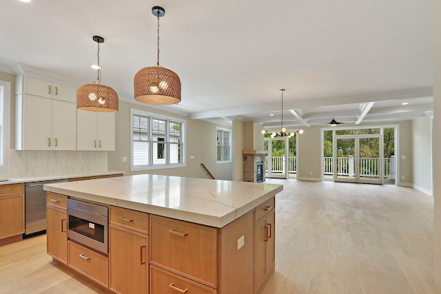 571 Mill St Unit 2, Fontana, WI 53125 - kitchen with appliances with stainless steel finishes, recessed lighting, light wood-style floors, a ceiling fan, and open floor plan