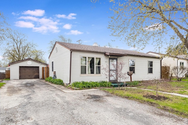 431 Montrose Dr, Romeoville, IL 60446 - ranch-style home featuring an outbuilding, a garage, asphalt driveway, and a chimney