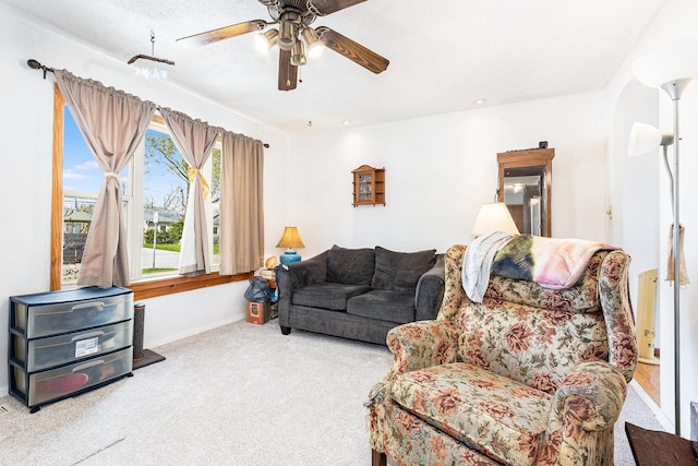 431 Montrose Dr, Romeoville, IL 60446 - carpeted living room featuring baseboards and ceiling fan