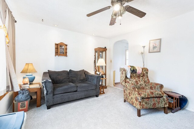 431 Montrose Dr, Romeoville, IL 60446 - living room with arched walkways, carpet floors, and ceiling fan
