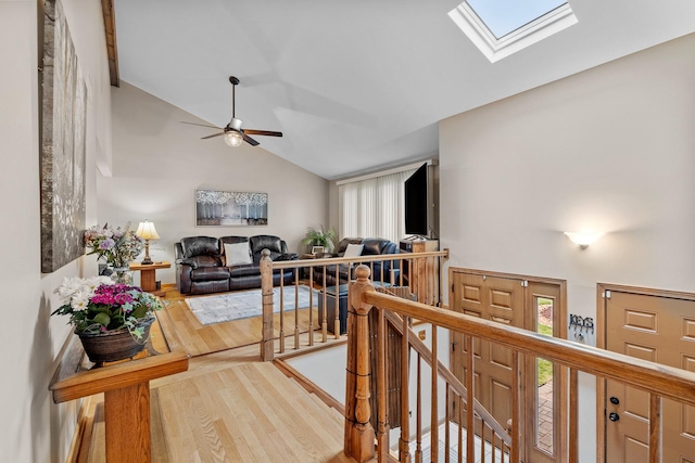 13641 W Ironwood Cir, Homer Glen, IL 60491 - hall featuring an upstairs landing, a skylight, wood finished floors, and high vaulted ceiling