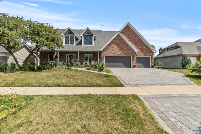 3560 Jeremy Ranch Ct, Naperville, IL 60564 - view of front facade featuring brick siding, an attached garage, a front yard, decorative driveway, and a porch