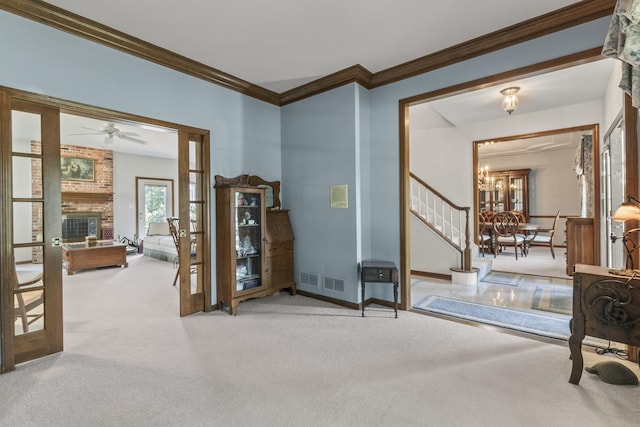 3560 Jeremy Ranch Ct, Naperville, IL 60564 - foyer entrance with carpet floors, crown molding, stairs, a ceiling fan, and a fireplace