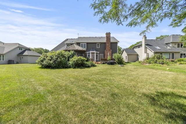 3560 Jeremy Ranch Ct, Naperville, IL 60564 - back of property with a yard and a chimney