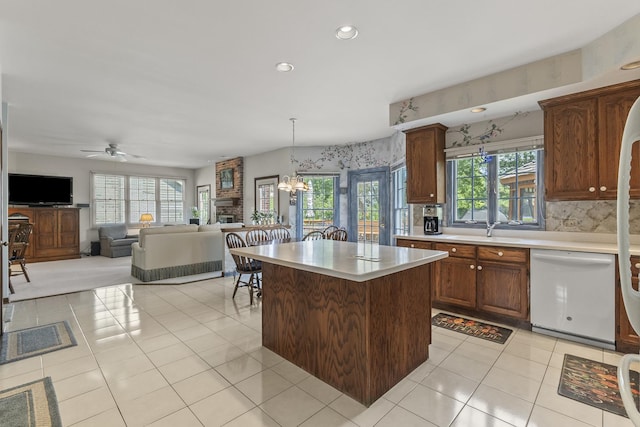 3560 Jeremy Ranch Ct, Naperville, IL 60564 - kitchen with white dishwasher, light countertops, light tile patterned floors, healthy amount of natural light, and recessed lighting