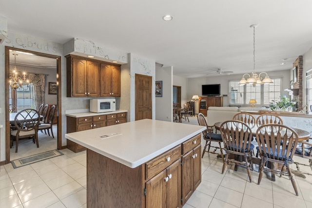 3560 Jeremy Ranch Ct, Naperville, IL 60564 - kitchen featuring a chandelier, white microwave, light countertops, and recessed lighting