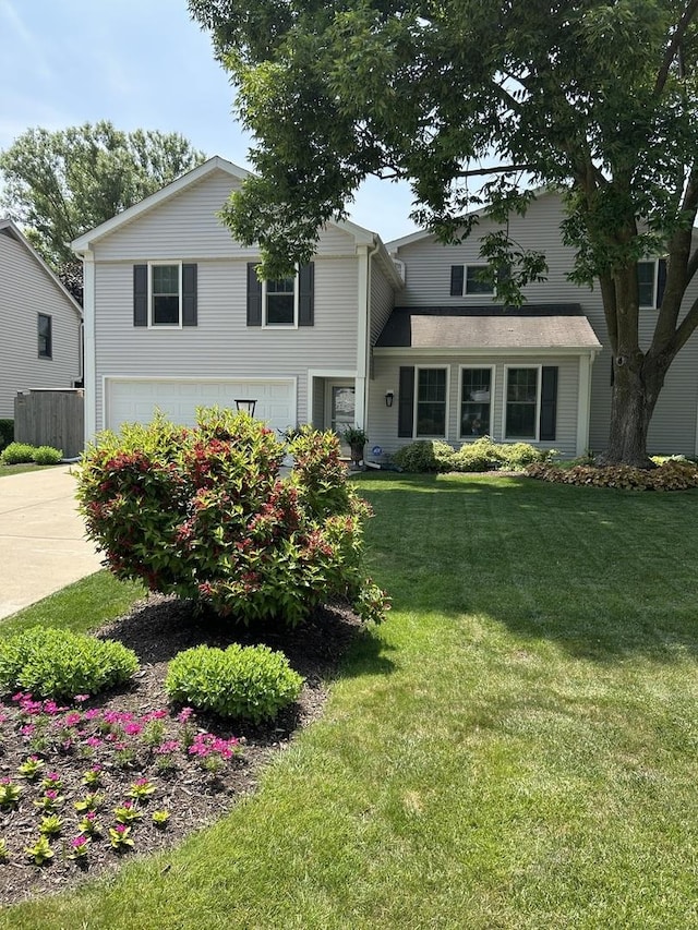 1505 Lita Ave, Deerfield, IL 60015 - traditional home featuring an attached garage, concrete driveway, and a front lawn