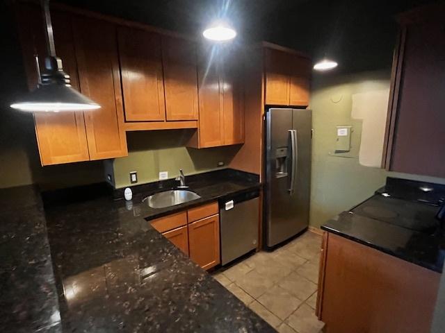 600 S Dearborn St Unit 308, Chicago, IL 60605 - kitchen with refrigerator with ice dispenser, stainless steel dishwasher, a sink, light tile patterned flooring, and dark stone counters