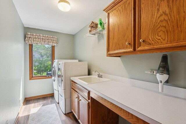 11624 Kluth Ct, Mokena, IL 60448 - laundry room featuring washing machine and clothes dryer, cabinet space, and wood finished floors