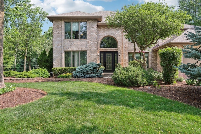 11624 Kluth Ct, Mokena, IL 60448 - view of front of house featuring a front yard, brick siding, and roof with shingles