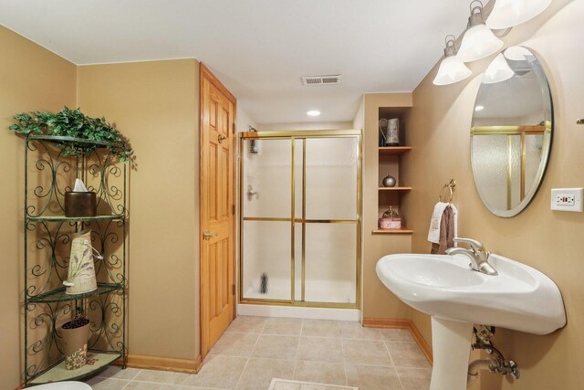 11624 Kluth Ct, Mokena, IL 60448 - bathroom featuring a stall shower and tile patterned floors
