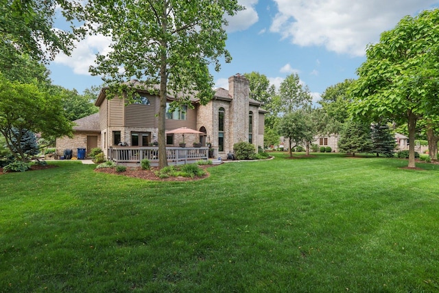 11624 Kluth Ct, Mokena, IL 60448 - rear view of house with a chimney, stone siding, and a lawn