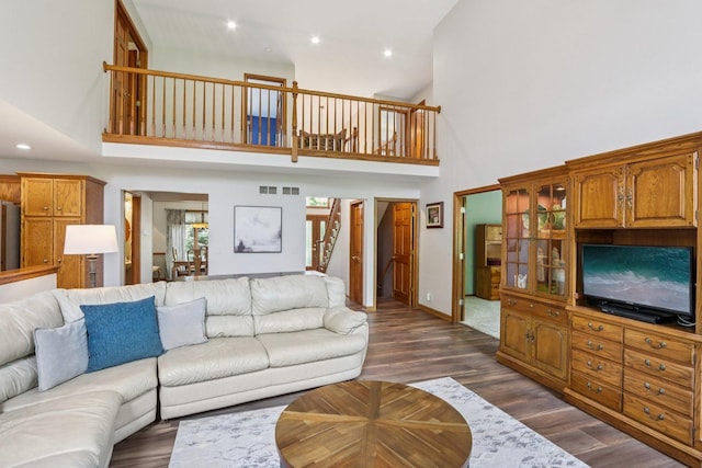 11624 Kluth Ct, Mokena, IL 60448 - living area featuring high vaulted ceiling, dark wood-type flooring, recessed lighting, and stairway