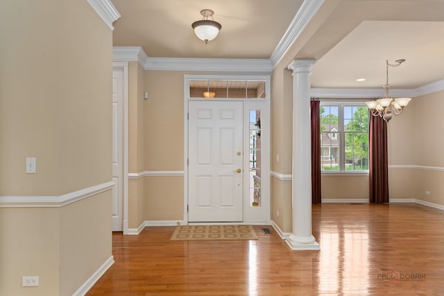 3 Joshua Ct, South Barrington, IL 60010 - foyer featuring ornate columns, wood finished floors, a chandelier, ornamental molding, and baseboards