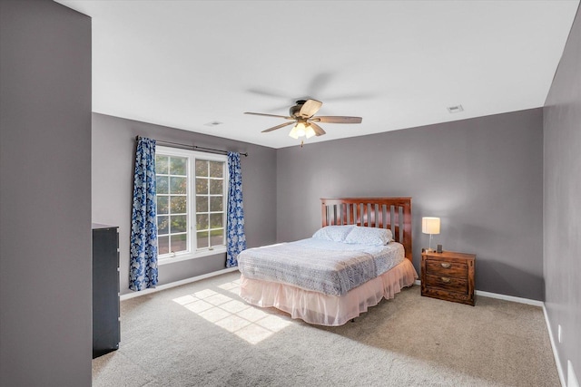 2107 Woodland Glen Ln, Champaign, IL 61822 - carpeted bedroom with baseboards and ceiling fan