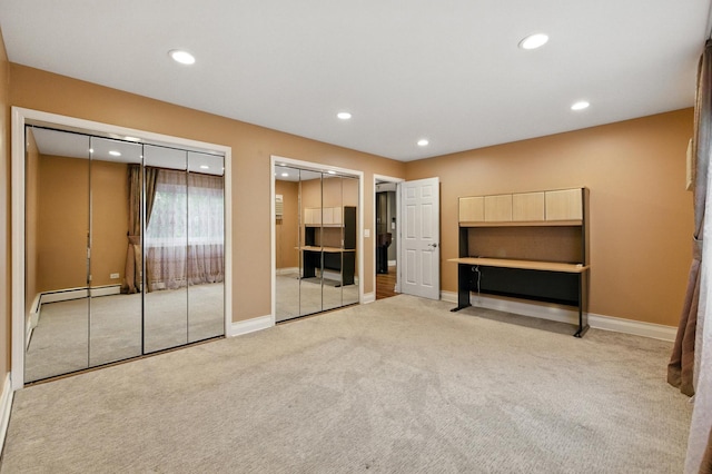 1258 Brown St Unit 204, Des Plaines, IL 60016 - unfurnished bedroom with carpet floors, two closets, recessed lighting, and baseboard heating