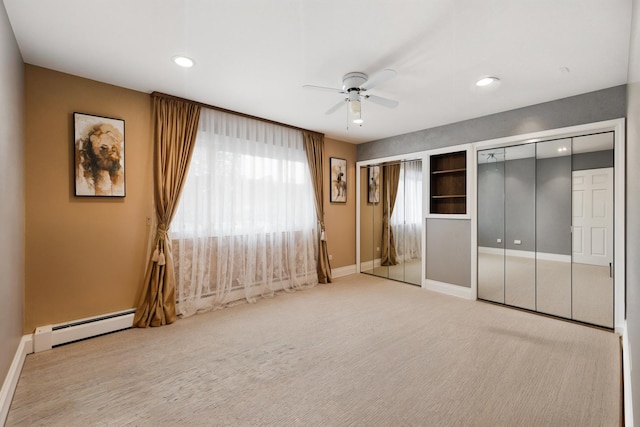 1258 Brown St Unit 204, Des Plaines, IL 60016 - unfurnished bedroom featuring baseboard heating, two closets, recessed lighting, and a ceiling fan
