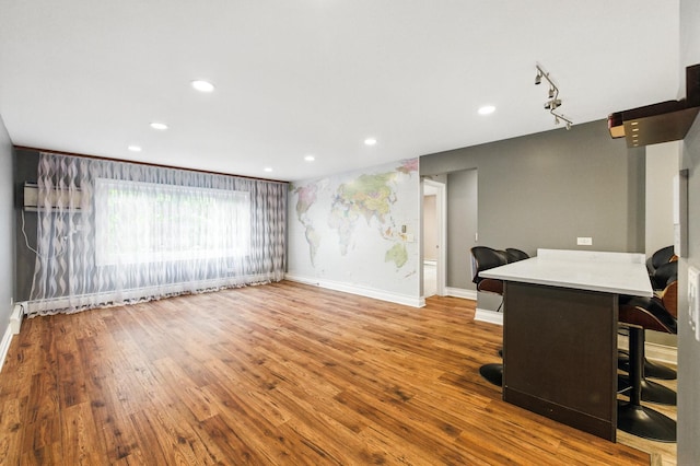 1258 Brown St Unit 204, Des Plaines, IL 60016 - unfurnished living room featuring wood finished floors and recessed lighting