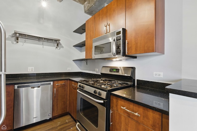 3150 N Sheffield Ave Unit 205, Chicago, IL 60657 - kitchen featuring stainless steel appliances, open shelves, dark stone counters, brown cabinets, and dark wood-style flooring