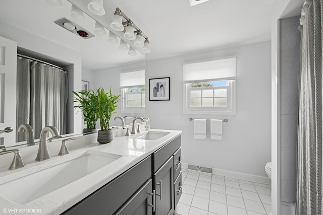 2734 N Dryden Pl, Arlington Heights, IL 60004 - bathroom with double vanity, baseboards, toilet, tile patterned flooring, and a shower with shower curtain
