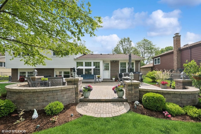 2734 N Dryden Pl, Arlington Heights, IL 60004 - rear view of property featuring a patio and brick siding