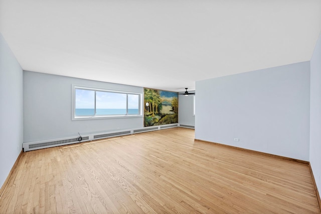 1050 W Columbia Ave Unit 3H, Chicago, IL 60626 - unfurnished room with wood finished floors and baseboards