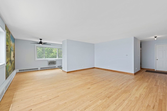 1050 W Columbia Ave Unit 3H, Chicago, IL 60626 - unfurnished living room with a baseboard heating unit, a ceiling fan, light wood-type flooring, a wall mounted air conditioner, and baseboards