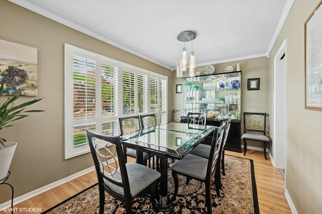 9519 Kolmar Ave, Skokie, IL 60076 - dining room with ornamental molding, light wood-type flooring, and baseboards