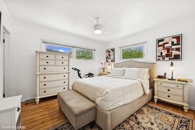 9519 Kolmar Ave, Skokie, IL 60076 - bedroom with wood finished floors, ornamental molding, and ceiling fan