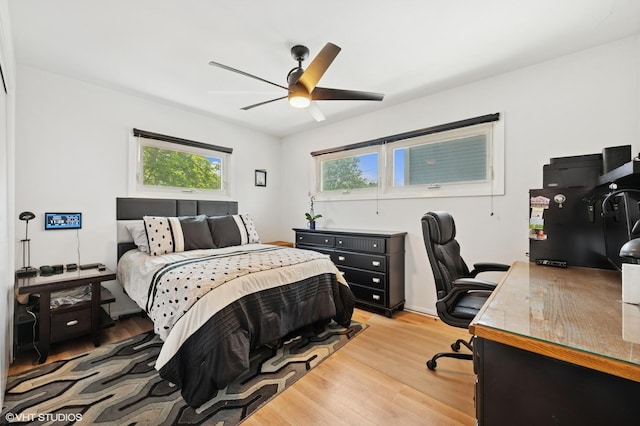 9519 Kolmar Ave, Skokie, IL 60076 - bedroom with light wood finished floors, a desk, and ceiling fan